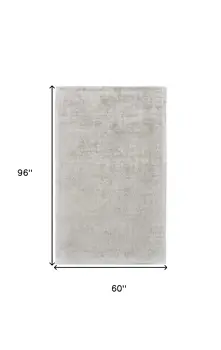 5' X 8' Gray and Ivory Abstract Hand Woven Area Rug