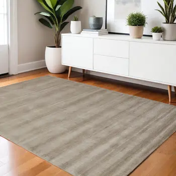 4' X 6' Tan Ivory And Taupe Hand Woven Area Rug