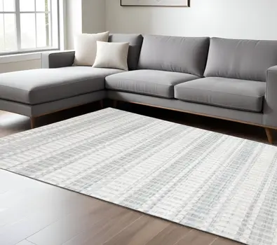 7' X 9' Ivory And Blue Striped Hand Woven Area Rug
