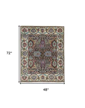 4' X 6' Ivory and Blue Wool Floral Hand Knotted Distressed Area Rug With Fringe