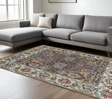 10' X 13' Ivory Brown And Blue Wool Floral Hand Knotted Distressed Stain Resistant Area Rug With Fringe