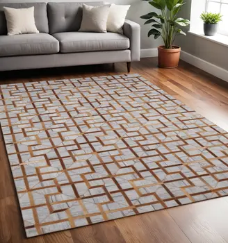 5' X 8' Tan and Brown Geometric Hand Woven Area Rug