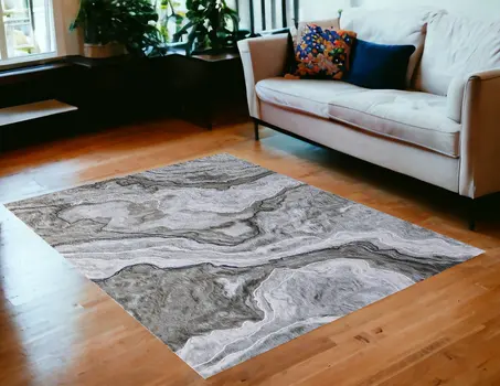 5' X 7' Ivory Blue and Gray Abstract Power Loom Area Rug