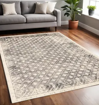 5' X 8' Ivory and Black Abstract Geometric Area Rug