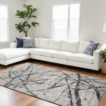 7' X 10' Taupe Gray And Ivory Abstract Stain Resistant Area Rug