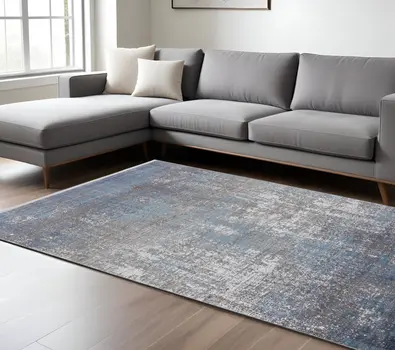 7' X 10' Blue and Gray Abstract Power Loom Distressed Area Rug With Fringe