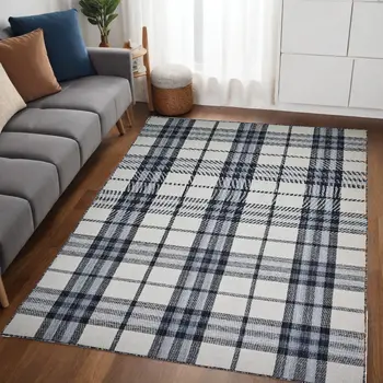 5' X 8' Ivory Blue And Black Abstract Hand Woven Stain Resistant Area Rug