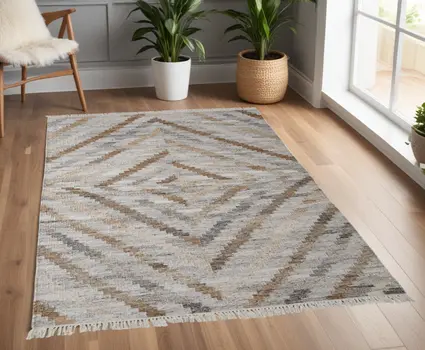 4' X 6' Gray and Ivory Geometric Hand Woven Area Rug With Fringe