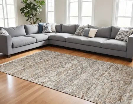 10' X 13' Tan Gray And Ivory Geometric Hand Woven Stain Resistant Area Rug With Fringe