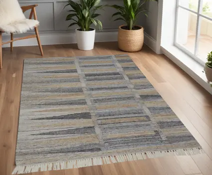 4' X 6' Tan and Gray Geometric Hand Woven Area Rug With Fringe