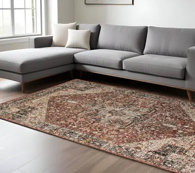 7' X 10' Red and Ivory Abstract Distressed Area Rug With Fringe