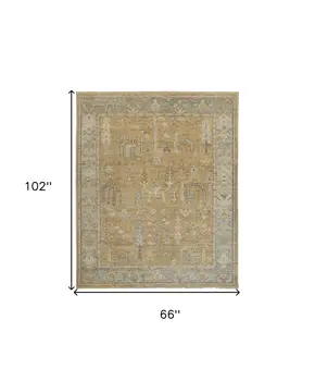 5' X 8' Gold Blue And Gray Wool Floral Hand Knotted Stain Resistant Area Rug With Fringe