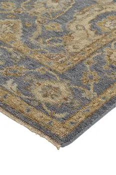 8' X 10' Blue Gold And Tan Wool Floral Hand Knotted Stain Resistant Area Rug With Fringe