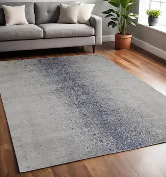 5' X 8' Ivory and Blue Abstract Power Loom Non Skid Area Rug