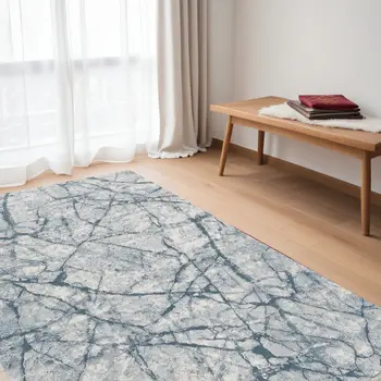 5' X 8' Blue Gray And Ivory Abstract Distressed Stain Resistant Area Rug
