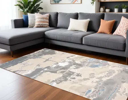 7' X 10' Ivory Gray And Blue Abstract Stain Resistant Area Rug