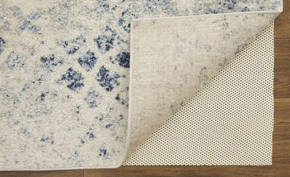 7' X 10' Ivory And Blue Abstract Power Loom Distressed Area Rug