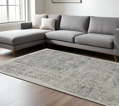 10' X 14' Green Blue And Ivory Abstract Hand Woven Area Rug