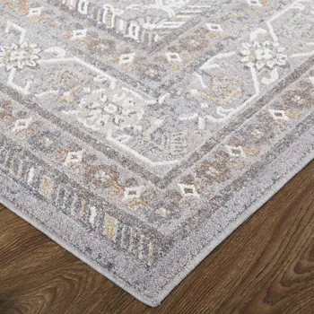 10' X 13' Gray Orange And Ivory Floral Power Loom Stain Resistant Area Rug
