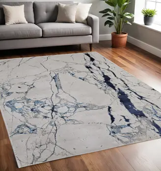 5' X 8' Ivory and Blue Marble Power Loom Distressed Area Rug