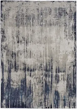 7' X 10' Tan Blue And Ivory Abstract Power Loom Distressed Area Rug