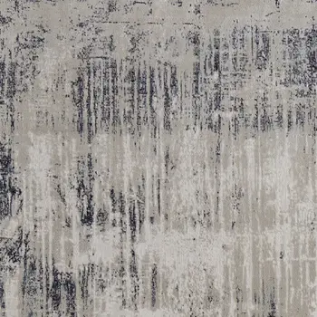 7' X 10' Tan Blue And Ivory Abstract Power Loom Distressed Area Rug