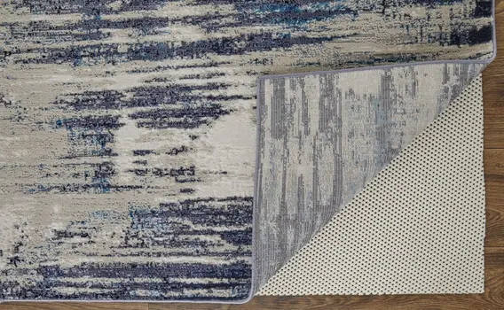 12' X 15' Tan Blue And Ivory Abstract Power Loom Distressed Area Rug