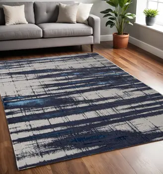 5' X 8' Ivory and Blue Abstract Power Loom Distressed Non Skid Area Rug