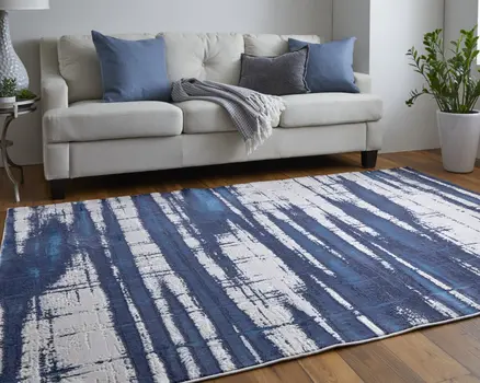 5' X 8' Ivory and Blue Abstract Power Loom Distressed Non Skid Area Rug