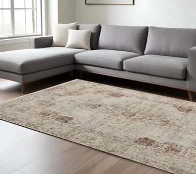 8' X 10' Tan and Ivory Floral Power Loom Distressed Non Skid Area Rug With Fringe