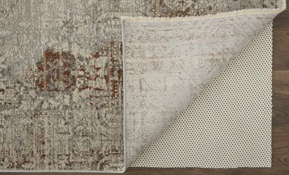 8' X 10' Tan and Ivory Floral Power Loom Distressed Non Skid Area Rug With Fringe