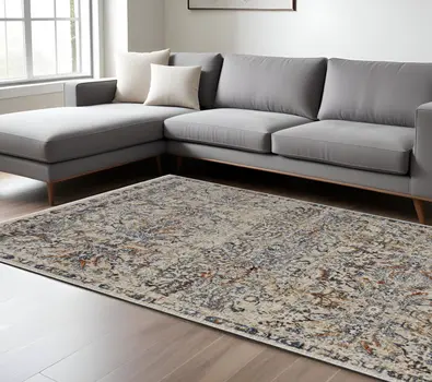 8' X 10' Tan and Blue Floral Power Loom Distressed Non Skid Area Rug With Fringe