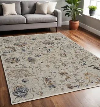 5' X 8' Ivory Blue And Burnt Orange Floral Distressed Area Rug With Fringe