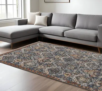 8' X 10' Blue Orange And Ivory Floral Power Loom Area Rug With Fringe