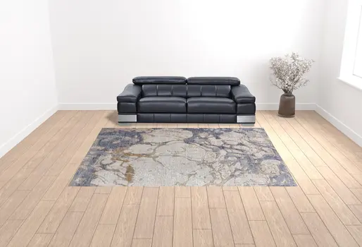 10' X 13' Tan And Blue Abstract Power Loom Distressed Area Rug