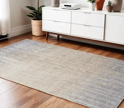 4' X 6' Tan Brown And Blue Abstract Power Loom Distressed Area Rug