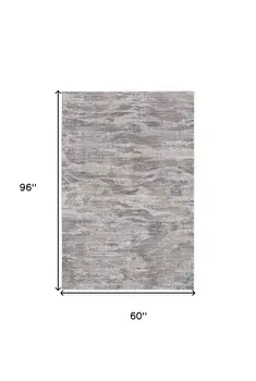 5' X 8' Tan and Gray Abstract Power Loom Distressed Area Rug