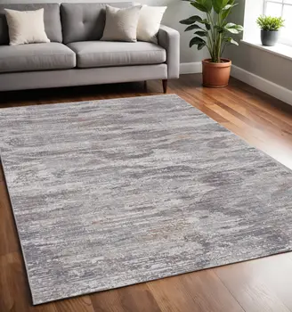 5' X 8' Taupe Tan and Orange Abstract Power Loom Distressed Area Rug