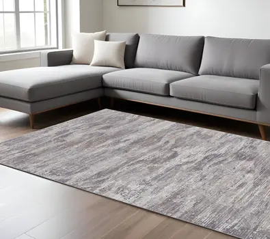 8' X 10' Taupe Tan and Orange Abstract Power Loom Distressed Area Rug