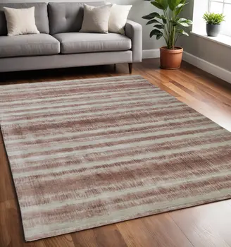 5' X 8' Tan and Ivory Abstract Hand Woven Area Rug