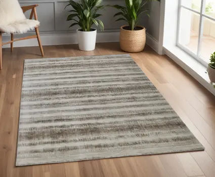 4' X 6' Tan and Ivory Abstract Hand Woven Area Rug