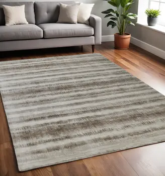 5' X 8' Tan and Ivory Abstract Hand Woven Area Rug
