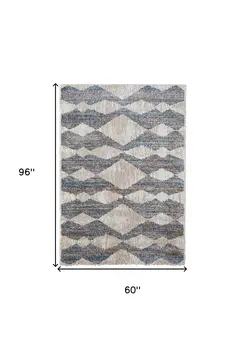 5' X 8' Tan Ivory And Blue Chevron Power Loom Stain Resistant Area Rug