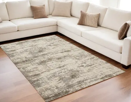 5' X 8' Ivory And Brown Abstract Area Rug