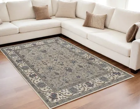 5' X 8' Ivory and Blue Wool Floral Hand Tufted Area Rug