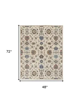 4' X 6' Ivory and Blue Wool Floral Hand Tufted Area Rug