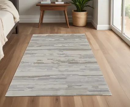 4' X 6' Brown and Ivory Abstract Power Loom Distressed Area Rug
