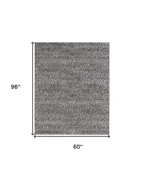 5' X 8' Gray and Ivory Abstract Power Loom Area Rug