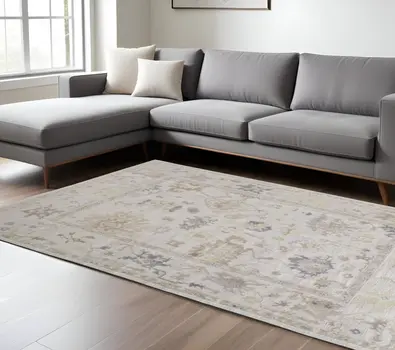 8' X 10' Tan Ivory And Orange Floral Hand Knotted Stain Resistant Area Rug