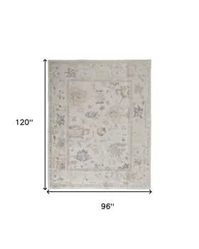 8' X 10' Tan Ivory And Orange Floral Hand Knotted Stain Resistant Area Rug